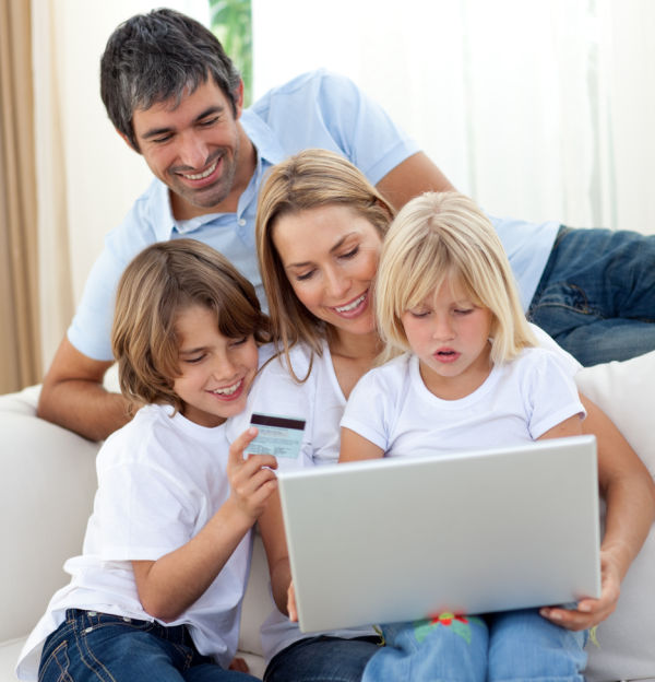 Young family shopping online in the living-room